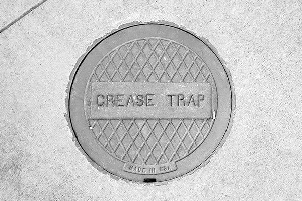 grease trap pumping requires specialized equipment and expertise to properly remove and dispose of the grease and waste